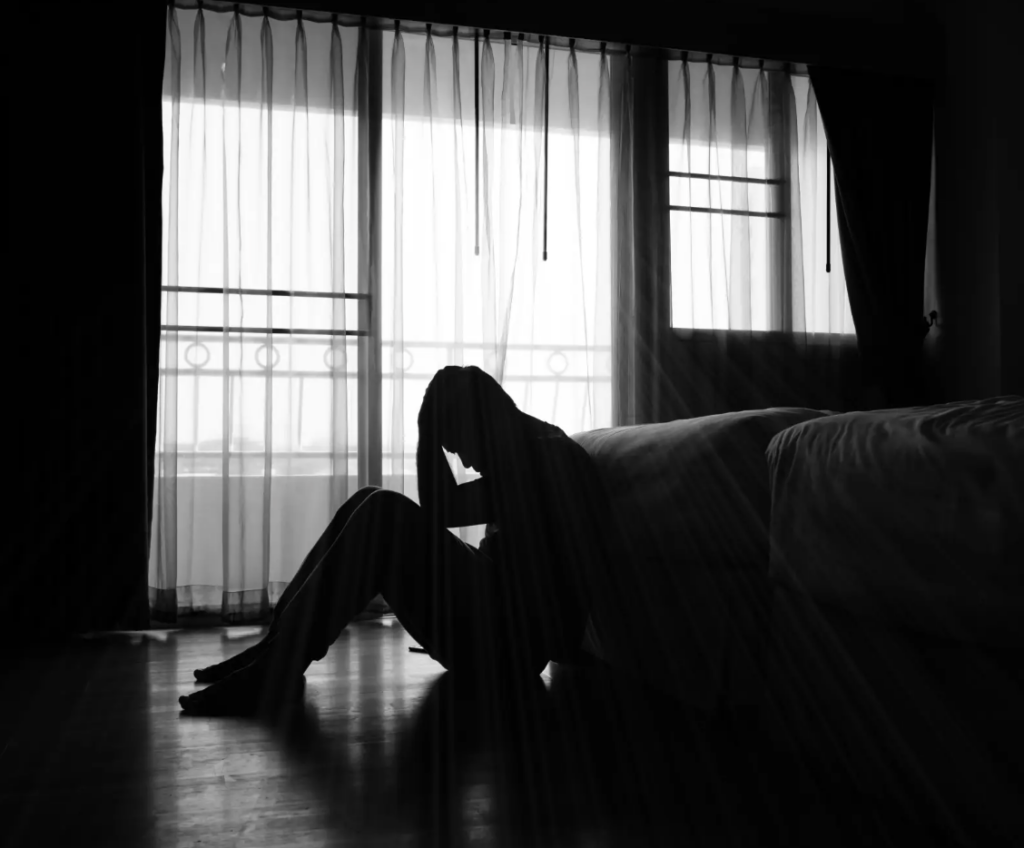 Depressed man in dark room