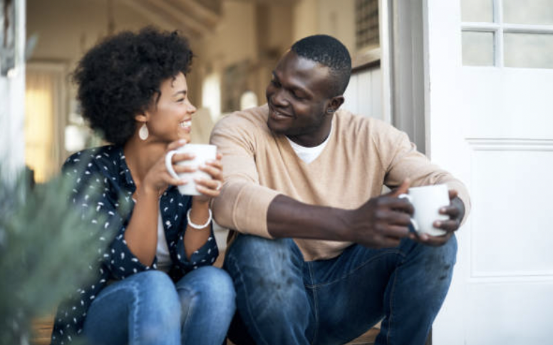 Couple talking while having coffee