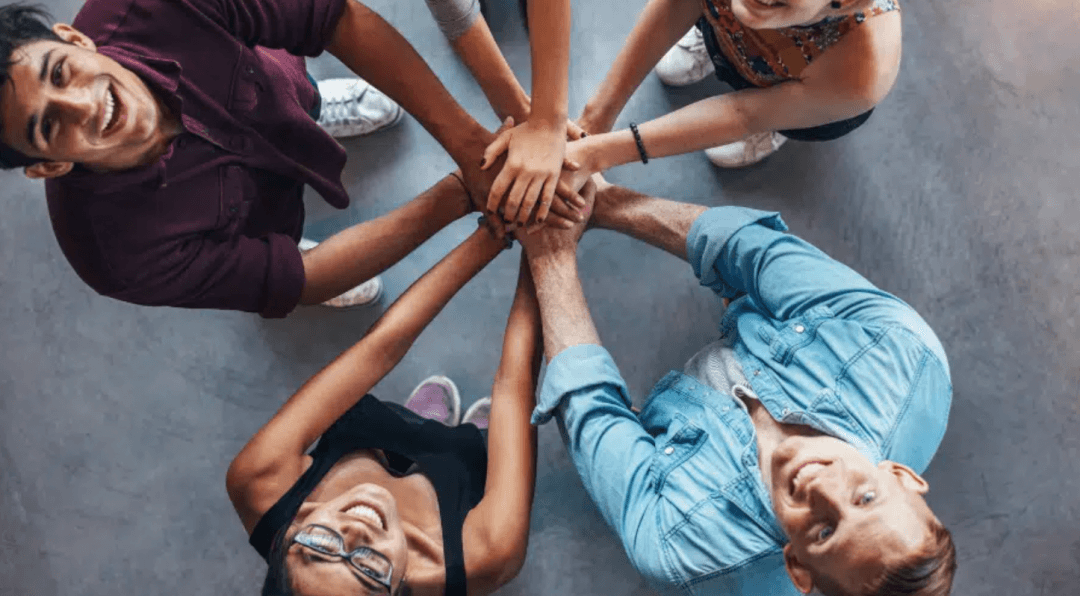 Group of people connecting hands