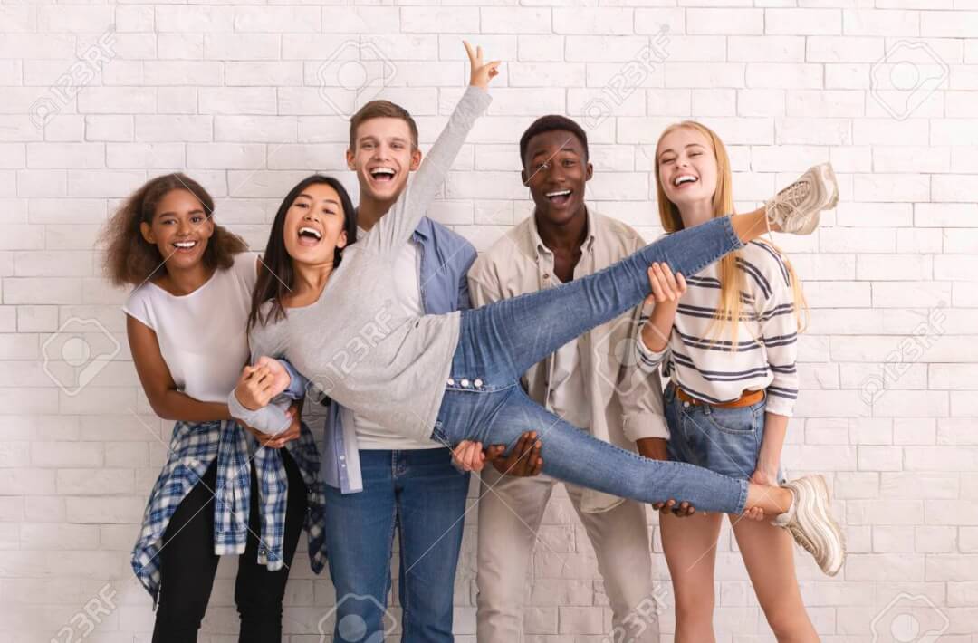 Young woman being celebrated by friends