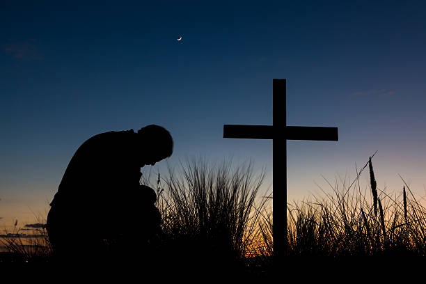 Man kneeling at the cross