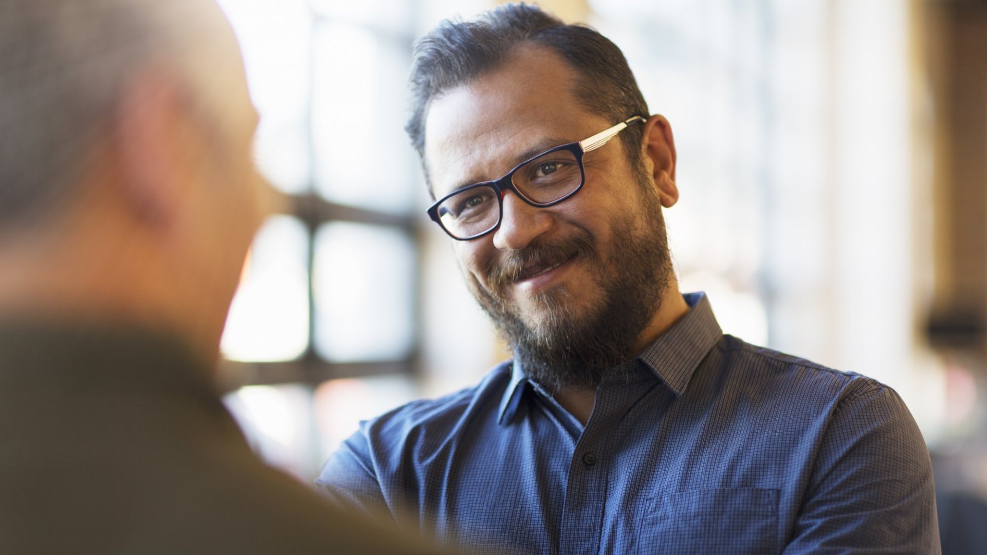 Man emotionally engaged in conversation with another man