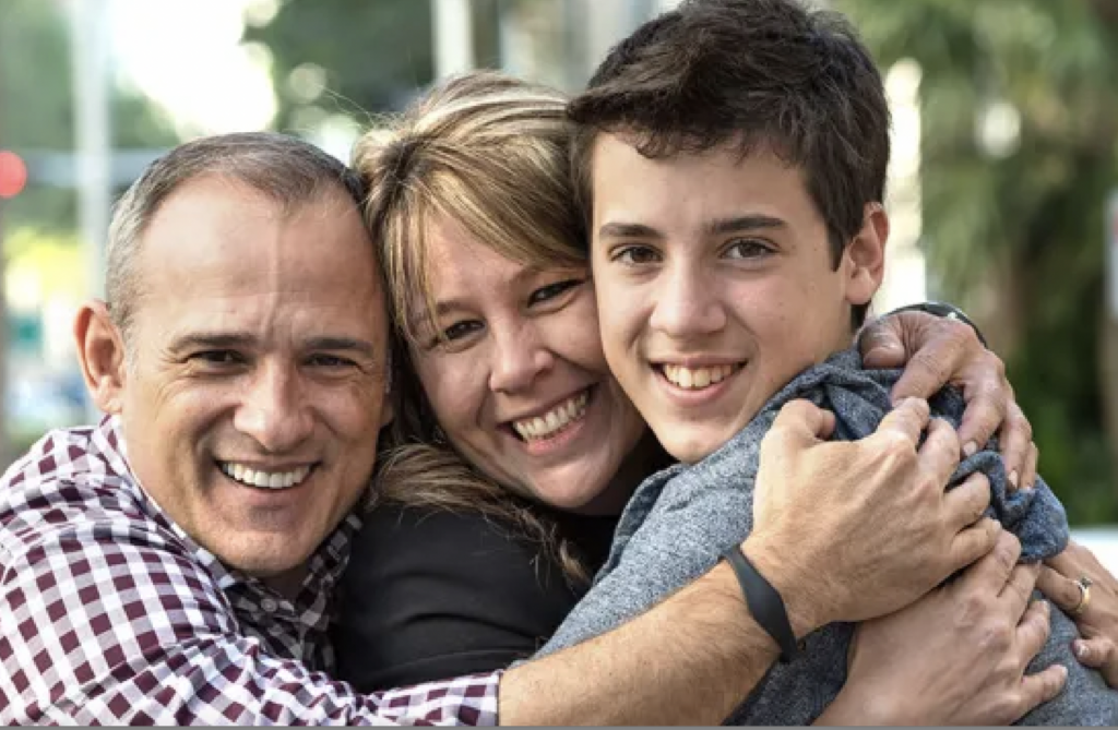 Teen boy with mom and dad