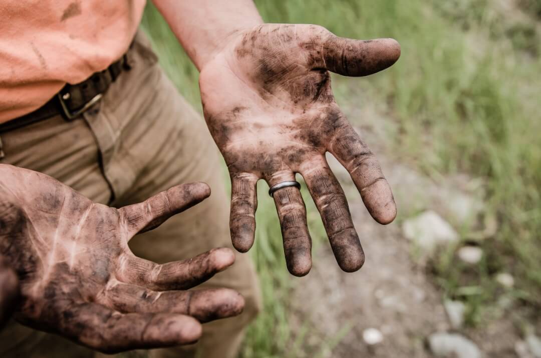 Man's hands dirty from work